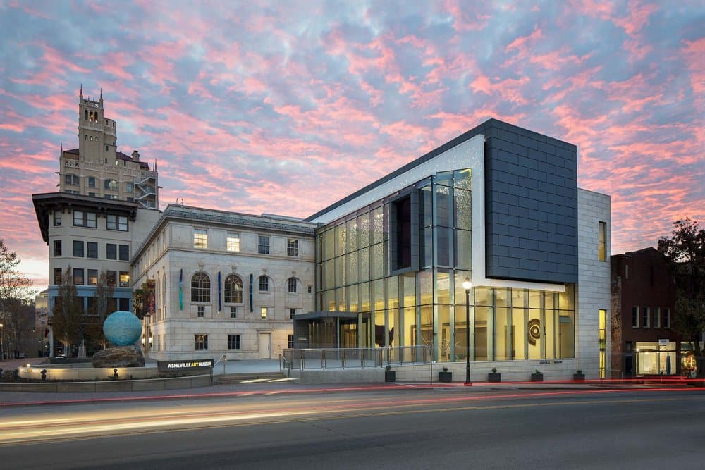 Asheville Art Museum displayed against a colorful sunset.